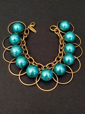 Metallic teal beaded hoop statement bracelet